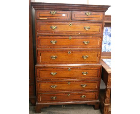 A Georgian oak mahogany strung and cross-banded chest on chest, with moulded cornice above two short and three long drawers, 