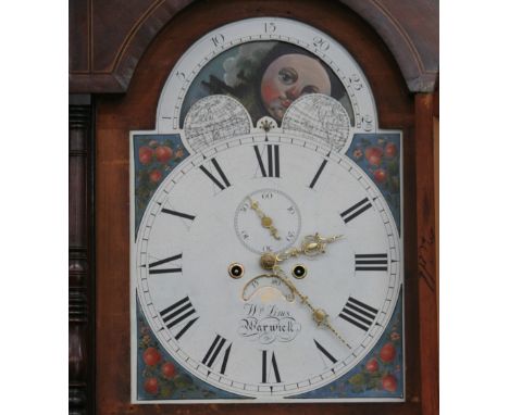 A George III oak mahogany cross-banded and boxwood strung long case clock, the hood with scroll arch pediment and turned colu