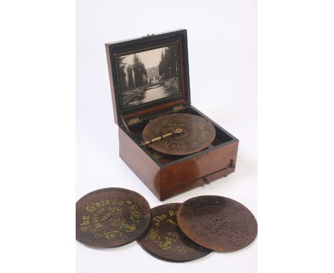 A walnut cased polyphon No.155101, complete with ten 8" discs, the case 25.5cm wide x 23.5cm deep, 15.5cm high