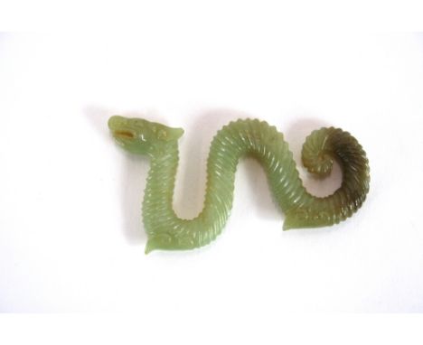 A Chinese Celadon jade model of a coiled dragon, 8cm long 