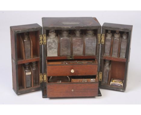 A 19th Century mahogany and brass mounted apothecaries cabinet, fitted various bottles, small set of scales, and a glass pest