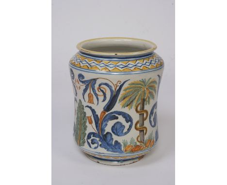A Majolica Alberello shaped jar, decorated brightly coloured stylised banding and scrolling flowers, central motif of s serpe