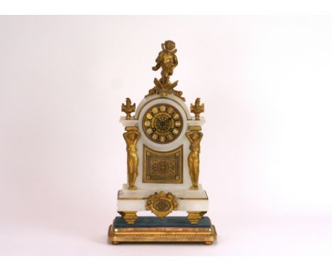 A late 19th Century French alabaster and gilt metal mantel clock, in the classical manner, the arched top surmounted by cheru