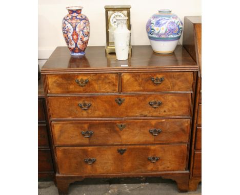 An 18th Century walnut chest, fitted two short and three long drawers, raised on bracket supports, 91cm wide