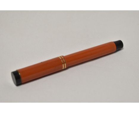 A Parker Duofold Lucky Curve Snr button fill fountain pen in red with two narrow bands to the cap having Parker Duofold nib. 