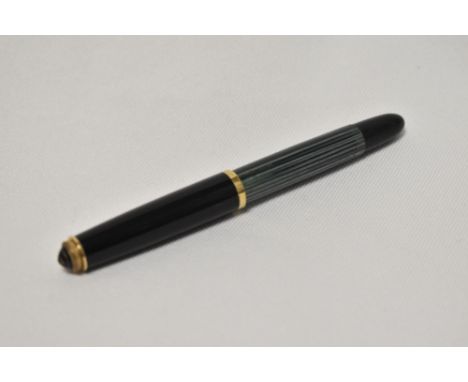 A Pelikan 400 piston fill fountain pen in green and black stripes having Pelikan 14C 585 OB nib.