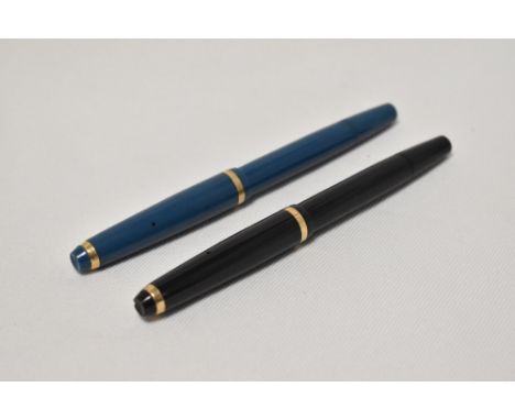 Two Onoto the Pen by De La Rue piston fill fountain pens one in black the other blue with a single band to the cap having Ono