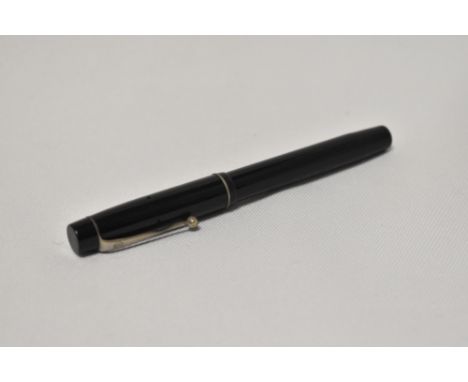 An Onoto the Pen 4601 by De La Rue piston fill fountain pen in black with two narrow bands to the cap having Onoto 14ct 2 nib