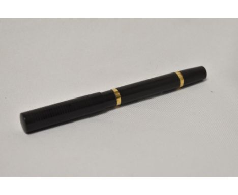 A Mabie Todd Blackbird self filler lever fill fountain pen in BHR with engine turned hoop design and two gold band to the bar