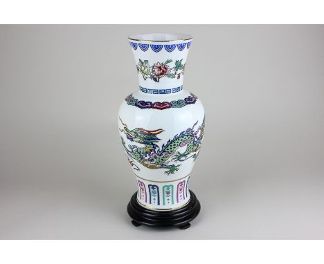 A Chinese porcelain vase, The Dance of the Celestial Dragon, marked FM1985 depicting dragon chasing the flaming pearl, with s