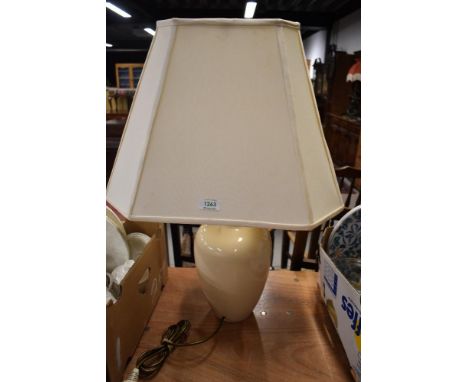 A ceramic table lamp with an octagonal shade.