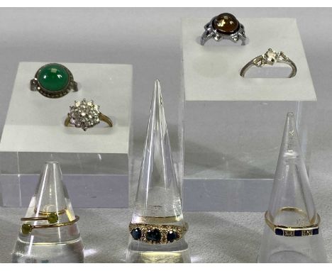 18CT, 9CT &amp; OTHER METAL DRESS RINGS (7) - the 18ct example set with an inline group of three blue and two white sapphires