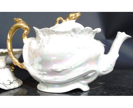 A 20th century Victorian style pearlescent part dinner service- to include egg cups, tea pot. 