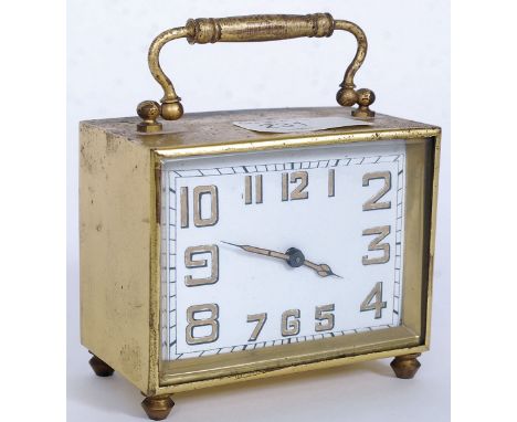 A good 1930's Art Deco brass cased mantel carriage clock with square face, decorative hands and numbers to chapter ring.