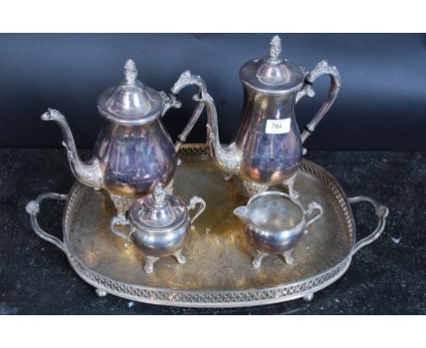 A silver plated tea service comprising of coffee pot, tea pot, sugar bowl, tray and milk jug.