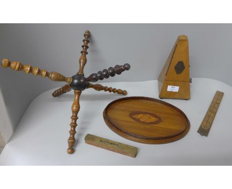 A Georgian turned wooden plate stand, an Edwardian oval inlaid tray, a ruler, brass top spirit level and a Maelzel Paquet Met