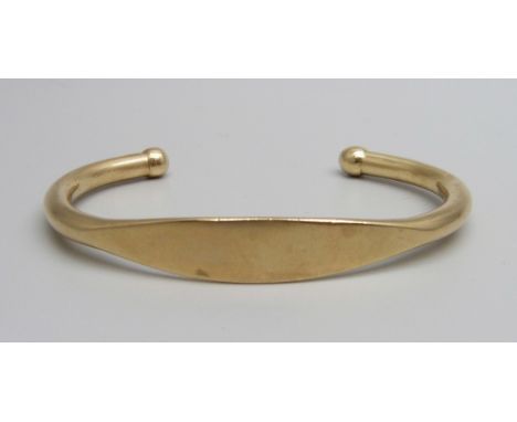 A 9ct gold bangle, 21.5g, back opening 32mm 