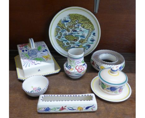 Seven items of Poole pottery including a cheese dish 