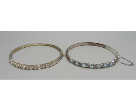 A silver and topaz bangle and a silver and white stone bangle 