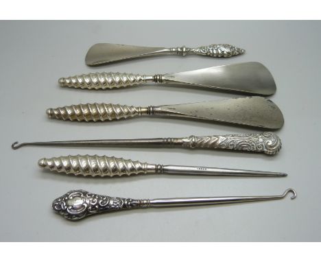 Silver handled button hooks and shoe horns 