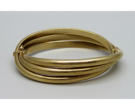 A 9ct gold bangle with hinge, 26.7g, 52mm x 58mm 