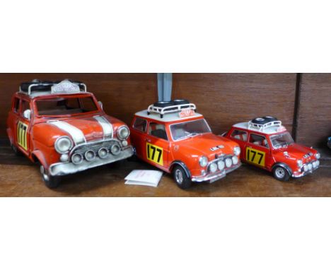 Three models of the 1960's Morris Mini Cooper Monte Carlo winning car, a tin plate model, a Corgi and a Franklln Mint (wing m