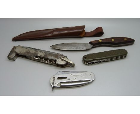 An Edwards &amp; Co. 'hammer' knife, a Victorinox standard issue German Army knife, a Currey Lockspike Bosun knife and one ot