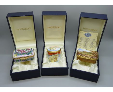 Three Moorcroft enamel lidded pots including Castle Howard 