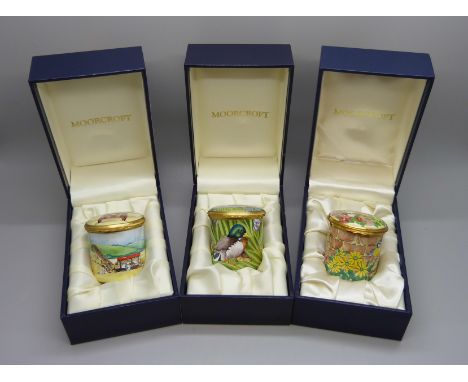 Two Moorcroft and one Royal Worcester enamel lidded pots
