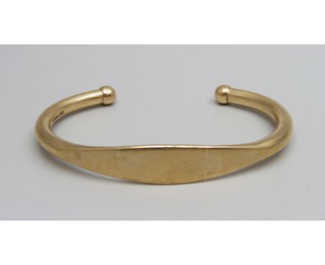 A 9ct gold bangle, 22.8g, (3cm opening) 
