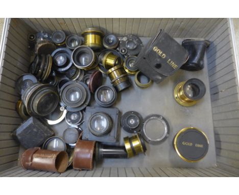A collection of lenses including magic lantern and a flight case