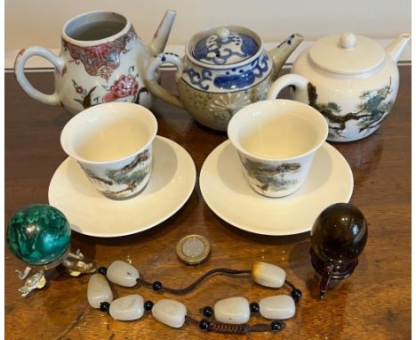 THREE JAPANESE TEAPOTS, TWO TEA BOWLS AND SAUCERS, POLISHED BEADS, MALACHITE SPHERE AND TIGER'S EYE