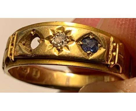 18ct GOLD RING SET WITH ONE DIAMOND APPROX 0.5ct AND ONE SAPPHIRE APPROX 0.7ct, TOTAL WEIGHT APPROXIMATELY 3.9g. ONE OF THE S