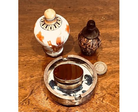 WALNUT SHELL PERFUME BOTTLE AND CERAMIC EXAMPLE, ALSO CERAMIC AND SILVER ASHTRAY AND POLISHED HARDSTONE PILL BOX