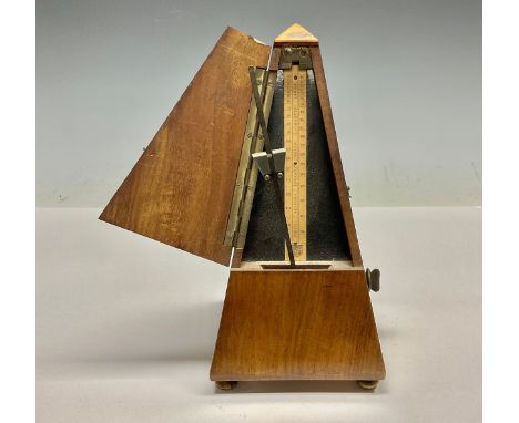 An early 20th century French walnut metronome 
