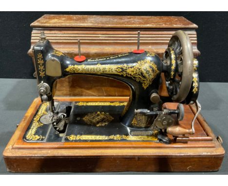 An early 20th century Singer hand crank sewing machine 
