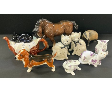 A Beswick model of a Bassett Hound; a Beswick brown Shire Horse; a Purbeck badger model; a pair of Rye Pottery polka dot mant