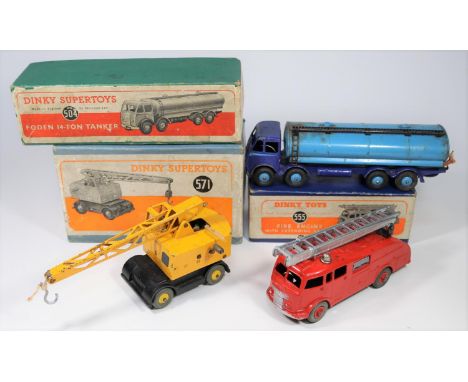 3x Dinky Toys. A Foden FG 14-ton tanker (504), with dark blue cab and chassis, light blue tank and wheels. A Fire Engine (555