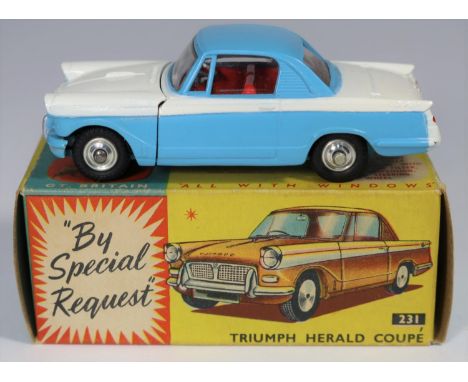 Corgi Toys Triumph Herald Coupe (231). Example in light blue and white, with red interior, dished spun wheels and black tyres