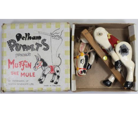 A Pelham Puppets 'Muffin The Mule puppet. A wooden articulated puppet painted in white with grey/black detailing, red/yellow 