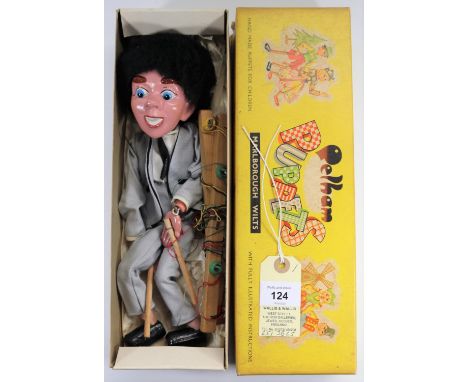 A rare Pelham Puppet in the style of a 1960's pop star, perhaps one of the group from The Beatles. In a light grey two piece 