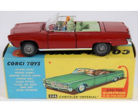 Corgi Toys Chrysler 'Imperial' (246). In red with pale blue interior, complete with driver and passenger and golf clubs in bo