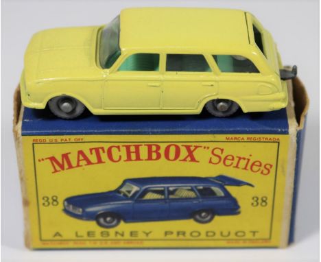 Matchbox Series No.38 Vauxhall Victor in yellow with clear  windows, green interior, grey plastic wheels and black base. Boxe