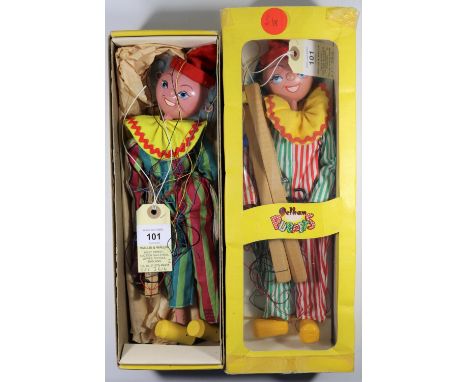 2 Pelham Puppet Clowns. Both similar examples, but with differences. One with two tone green, pink/green striped one piece an