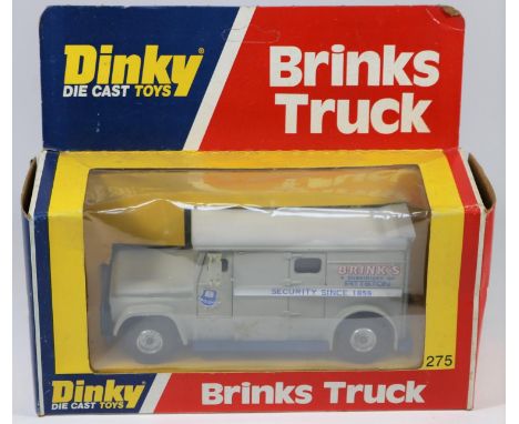 A Dinky Toys US issue Brinks Truck (275). Example with grey body, light grey roof and blue chassis. Boxed with inner packing 