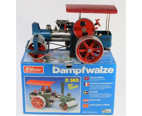 A 'West German' produced Wilesco 'Dampfwalze' (Steam Roller). A similar scale and design to Mamod, painted in blue and red wi