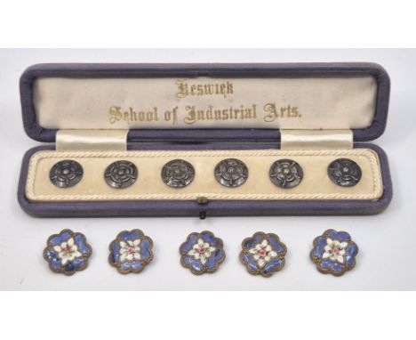 A Keswick School of Industrial Arts set of six white metal buttons, each diameter 15mm, in original silk lined fitted case, t