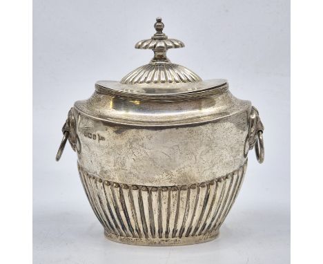 A Victorian silver twin handled oval tea caddy, by Walker &amp; Hall, Sheffield 1897, with semi-fluted side and cover and lio