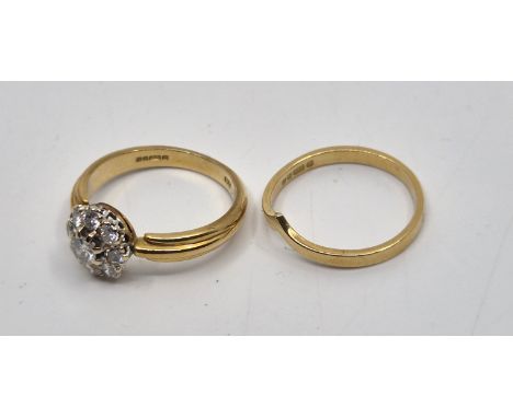 An 18ct. gold diamond cluster ring, by Richard Ogden, London 1983, the lobed mount set central round brilliant cut diamond bo