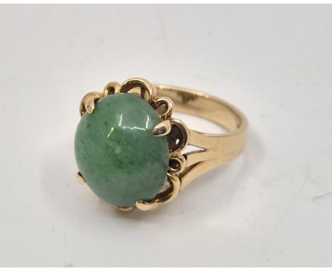 A 14ct. gold and nephrite jade ring, claw set single oval cabochon nephrite green jade to centre, size UK N. (gross weight 6.